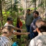 Mctlaw Indian Law practice group out in forest with Suak-Suiattle Tribe during visit