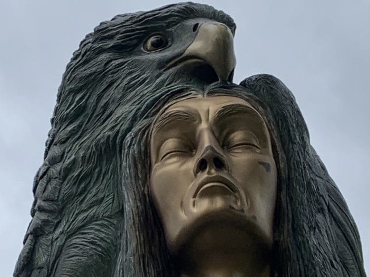 Statue of Indian with Eagle Resting Beak on Head