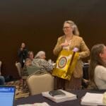 Sophie Asher is honored with a gift for speaking at the United Keetoowah Band Housing Retreat. 
