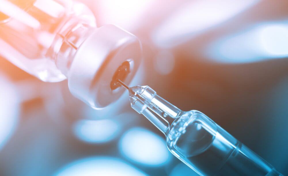 Vaccine being drawn into syringe